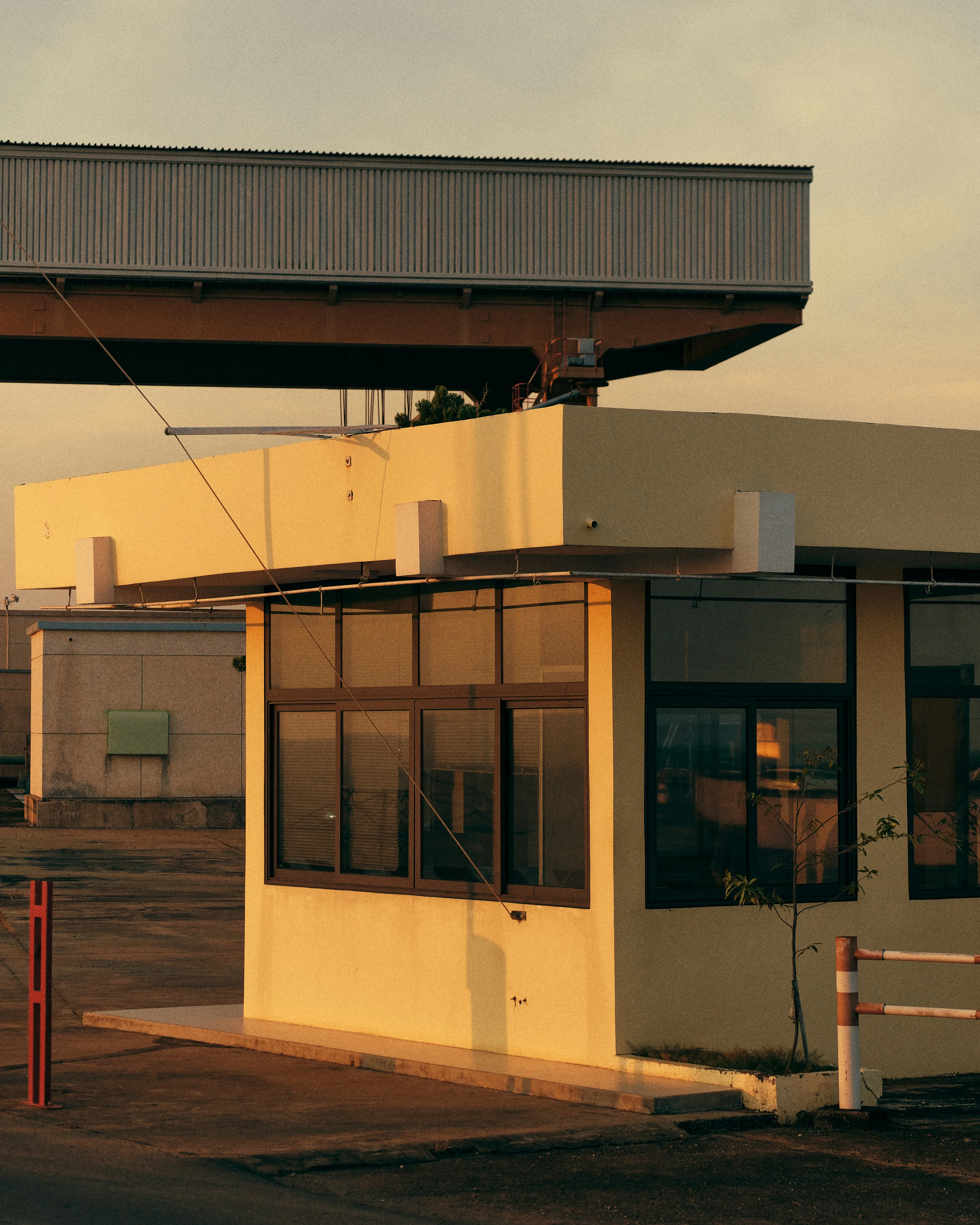 Construction site gatehouse and access point at sunset