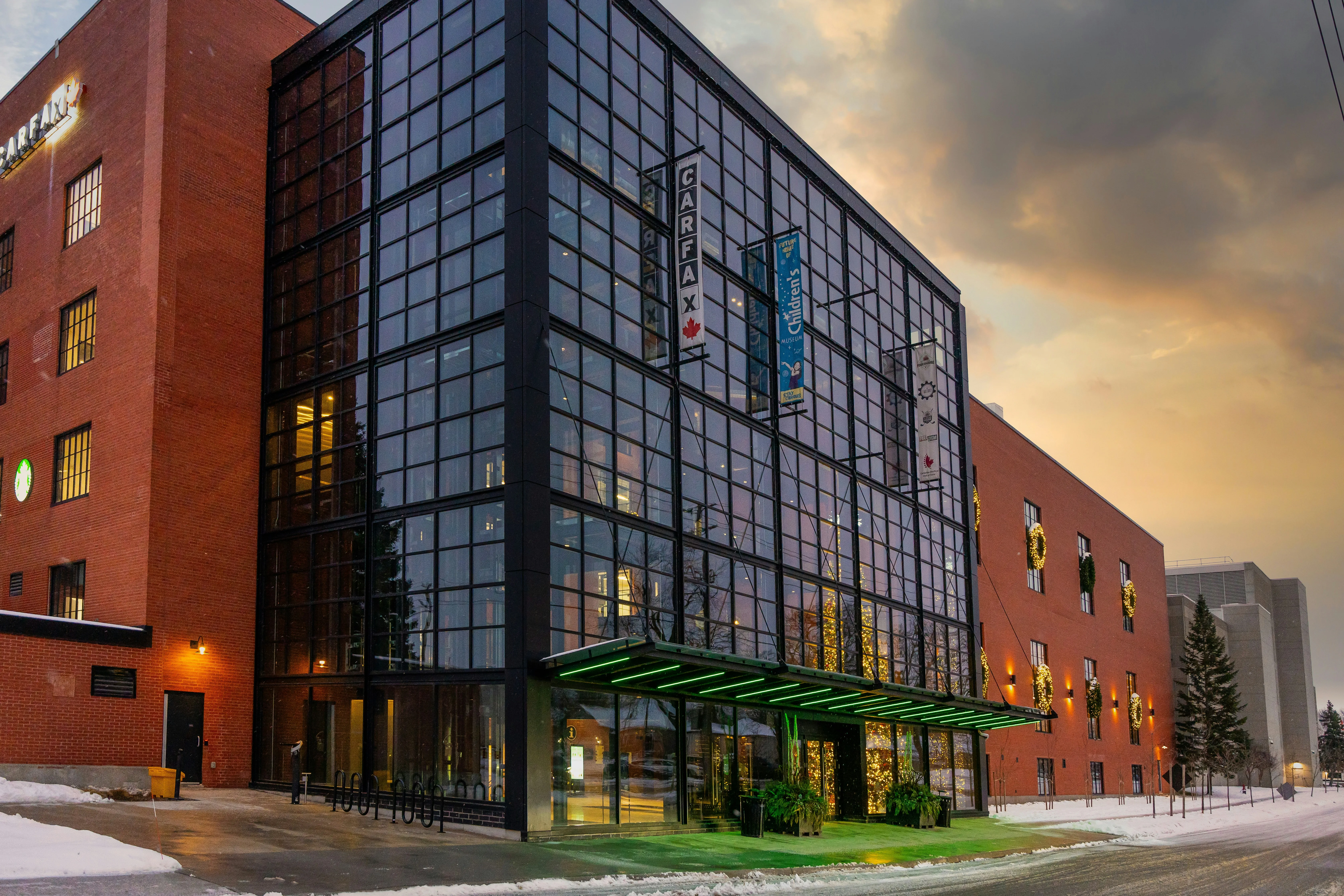 Industrial building at dusk with security lighting