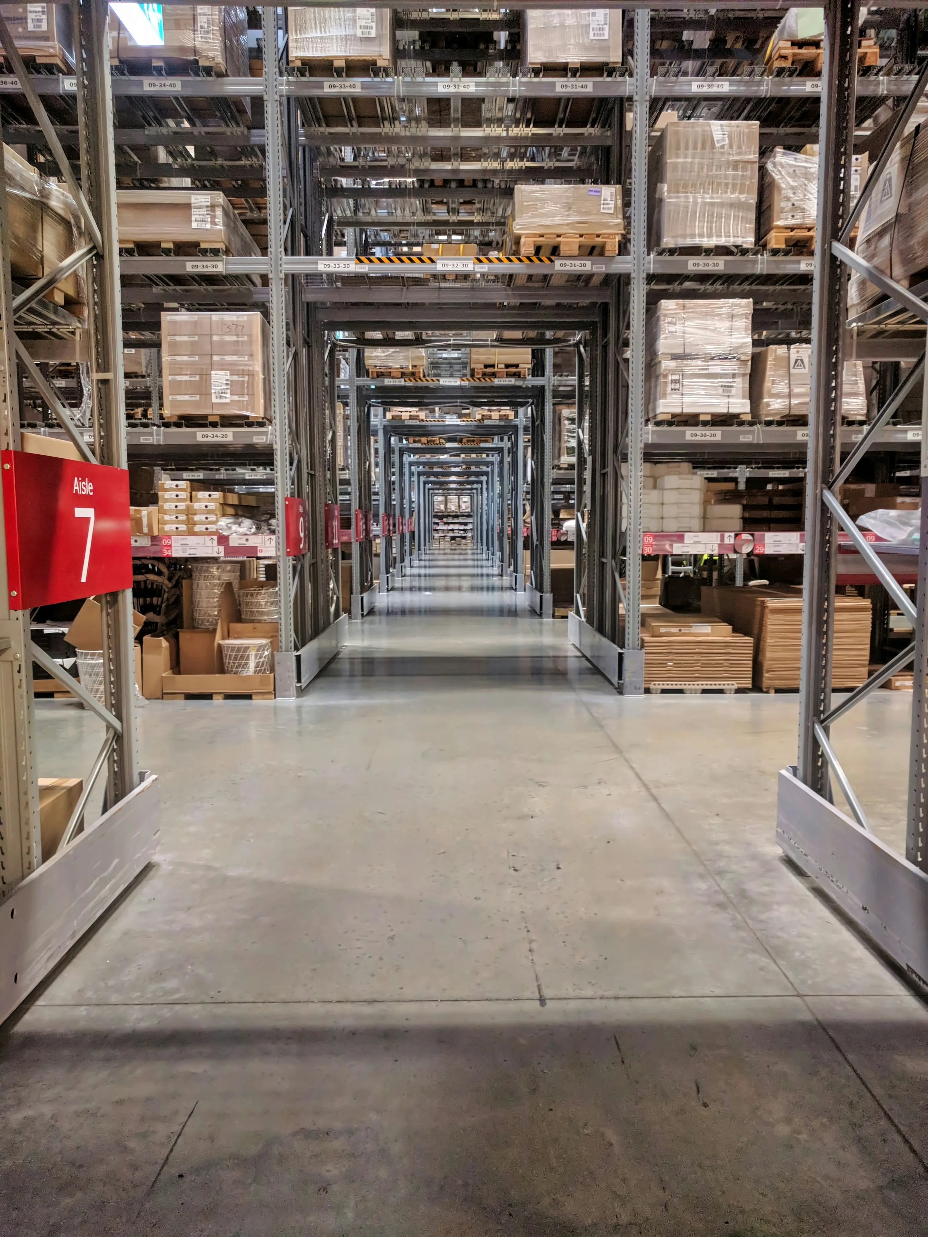 Warehouse distribution centre with tall racking aisles